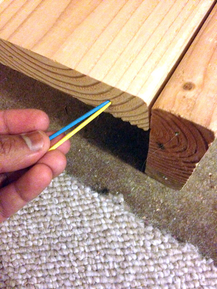 Using a toothpick trick to plug existing holes while building a bookcase