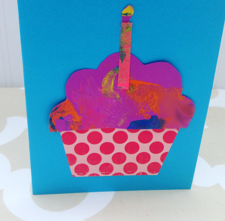 Using scrap book paper and kids paintings to make homemade birthday cards from toddlers