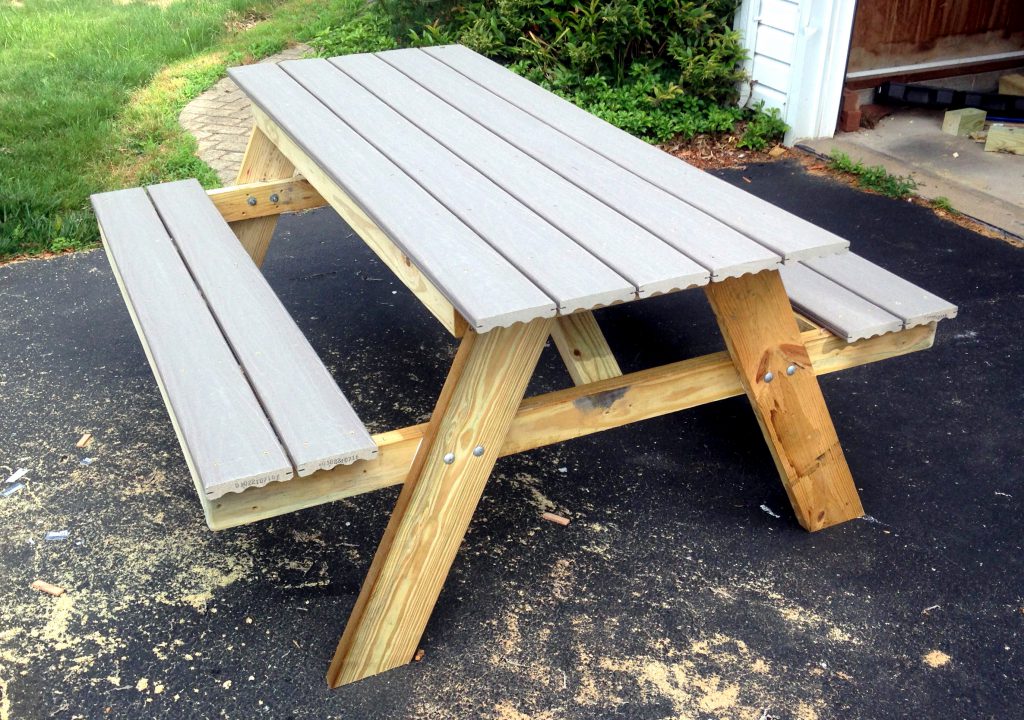 Elegant DIY picnic table made from reclaimed barn door