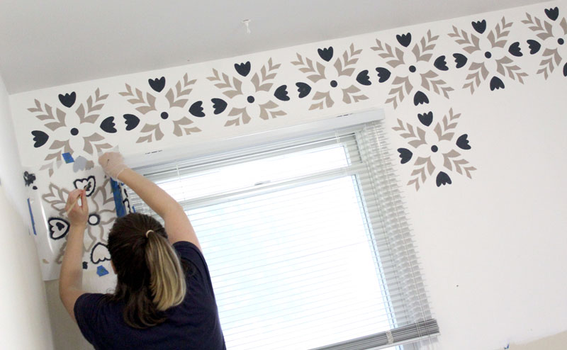 Stenciling an accent wall in the mudroom