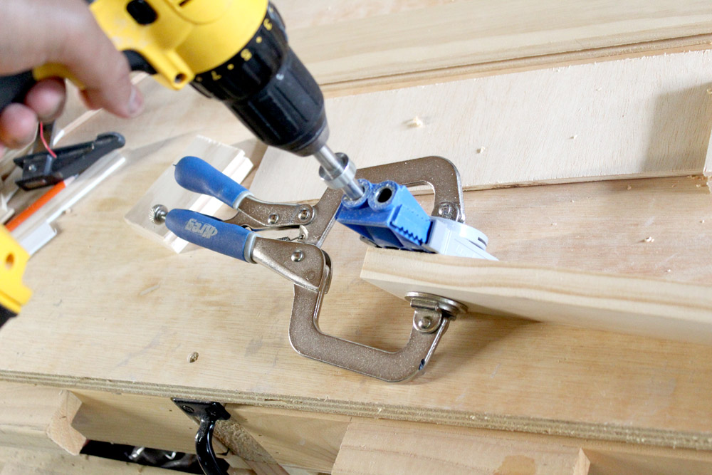 Drilling pocket holes into drawer front pieces to make shaker-style drawer fronts