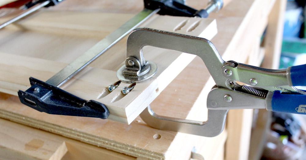 Using clamps to screw pocket holes into drawer fronts