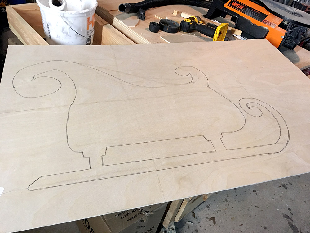 Sleigh outline drawn on plywood to make outdoor yard decoration