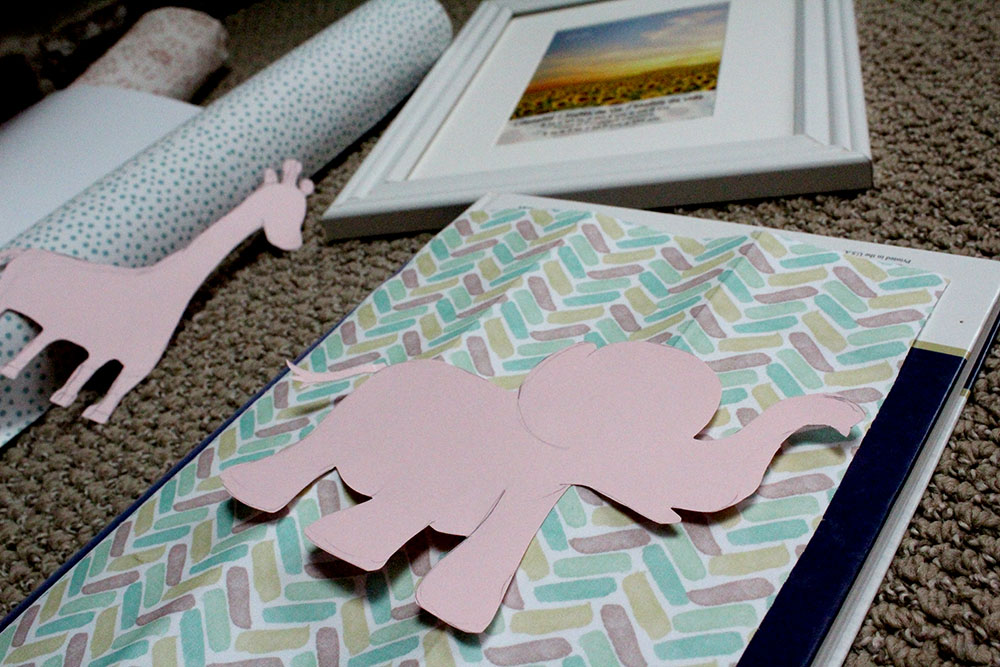 Pink elephant cutout on adhesive fabric to make easy DIY nursery wall art