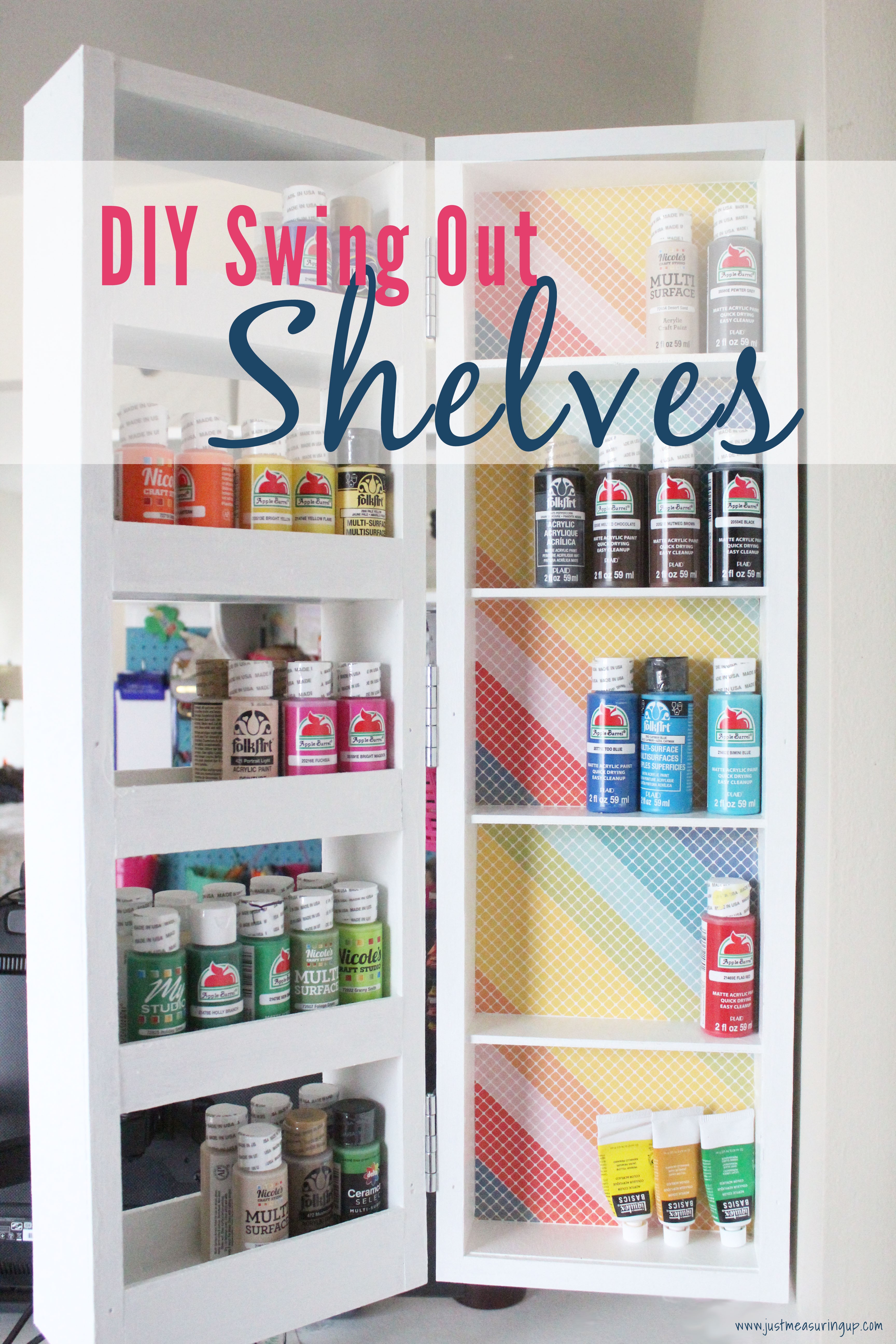 DIY swing out shelves in the craft room holding acrylic paint