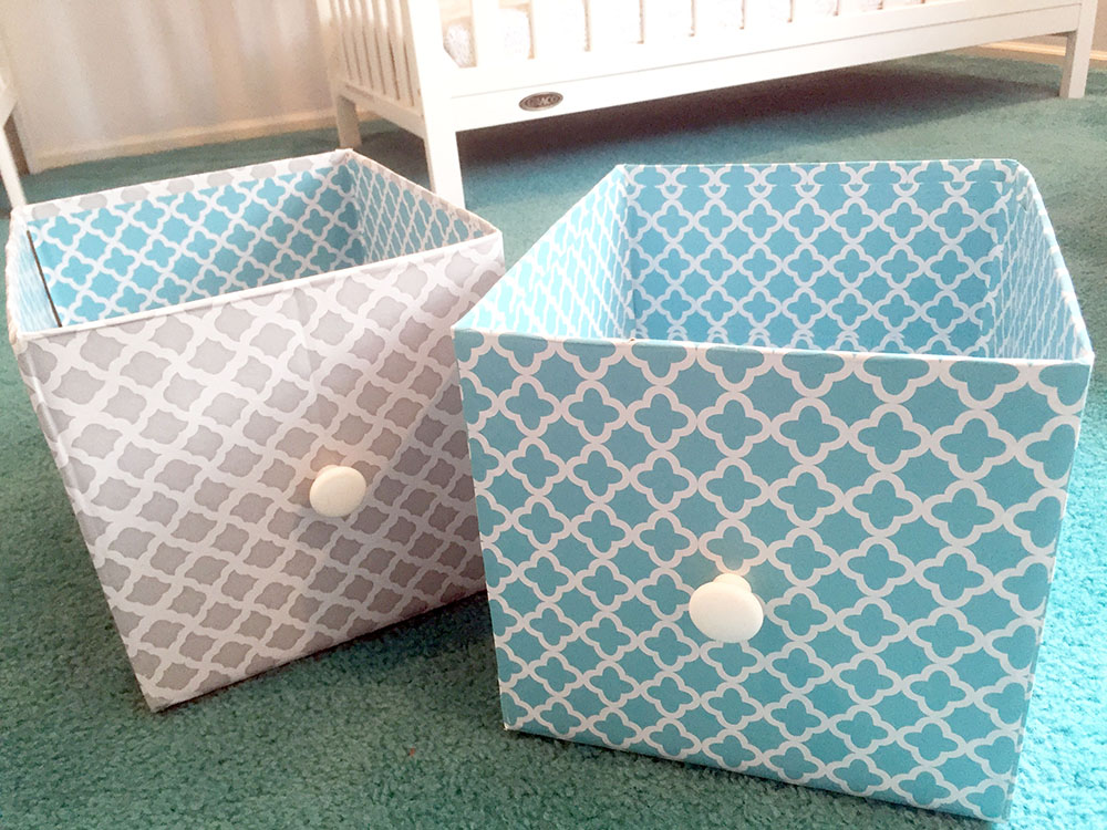 Turquoise and gray DIY storage bins made from cardboard boxes for nursery changing table