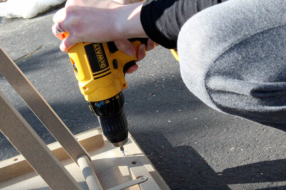 Attaching a new checkerboard tabletop to an old folding TV tray table