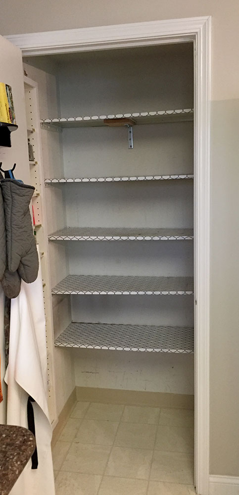 Before picture of an empty pantry before diy pantry wood shelving with drawers