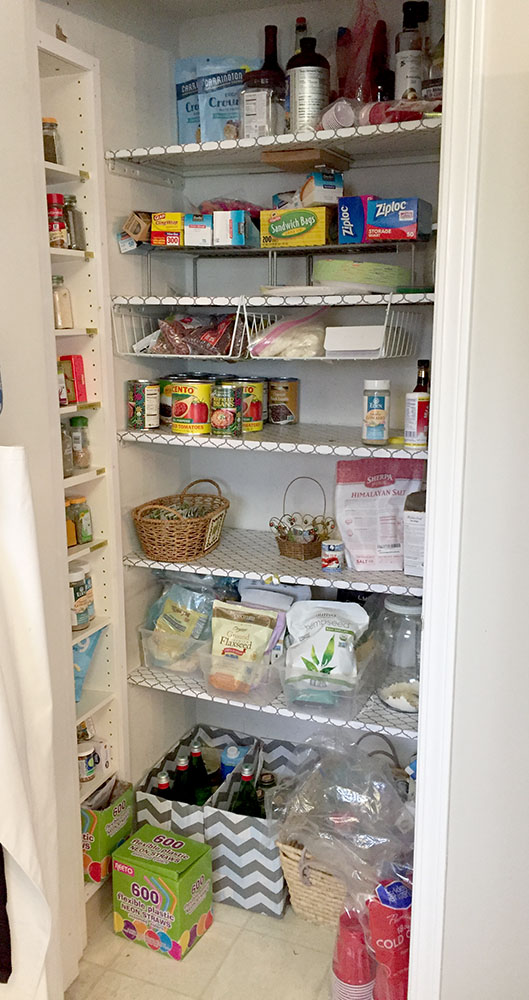Before picture of messy pantry with metal shelving