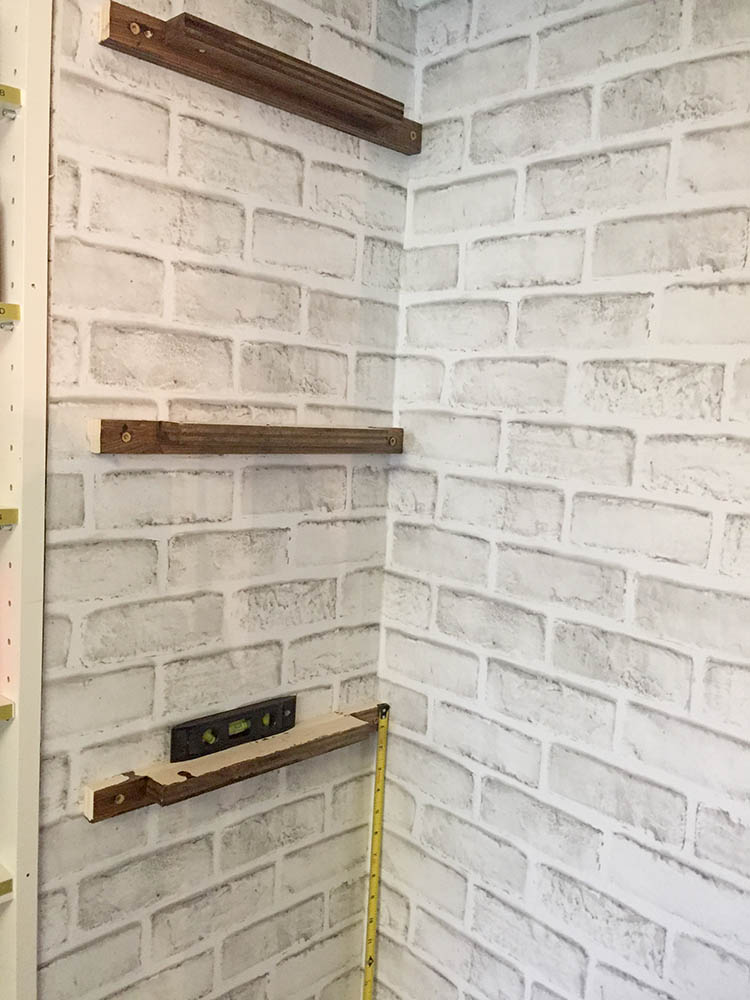 Attaching shelf supports to pantry wall for built in pantry shelves